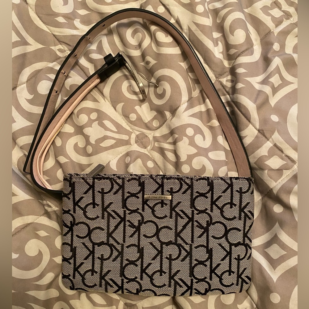 Black and grey Calvin Klein fannie pack waist bag.